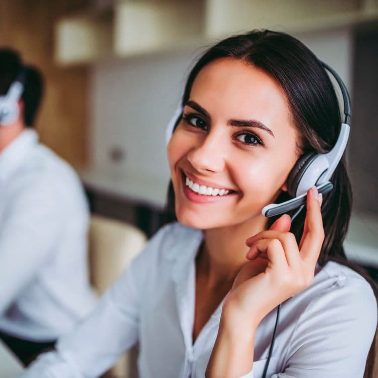 Woman with a headset, possibly working in a call centre.