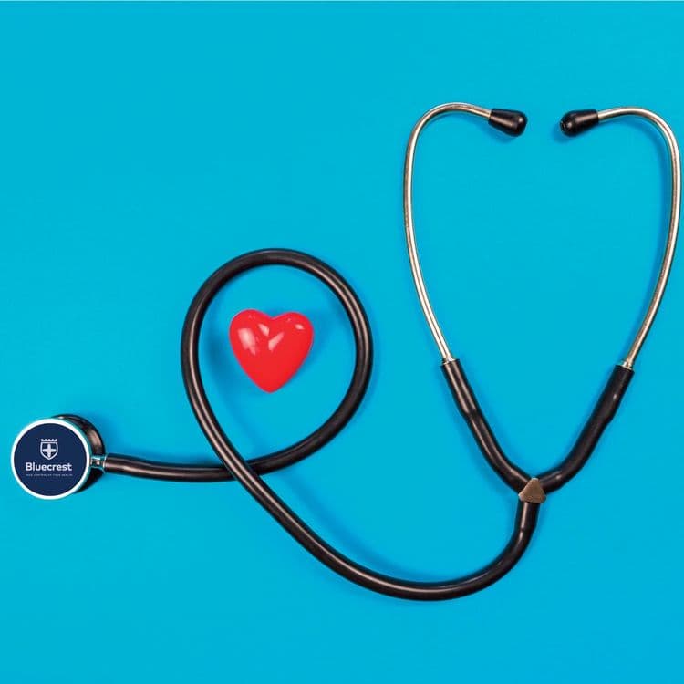 A stethoscope on a blue background surrounding a red heart figure.