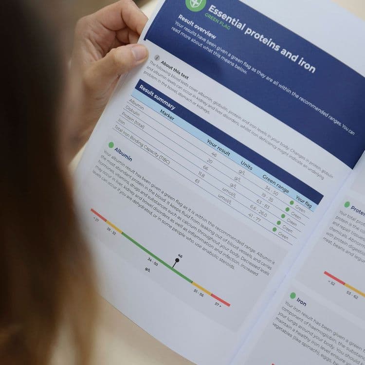 Results page being read from a hard copy Bluecrest Wellness personal health report